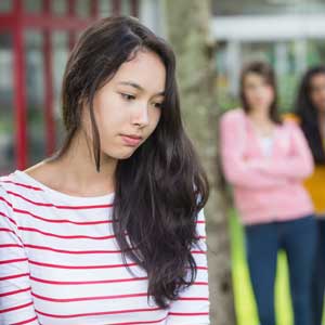 Sad girl left out of group